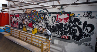 Behind Artist 2Shae's "Pill Head" Mural at The Hundreds Homebase